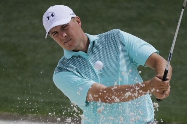 Jordan Spieth hits from a bunker on the 18th hole during a practice round for the Masters golf tournament Wednesday, April 4, 2018, in Augusta, Ga. (AP Photo/David J. Phillip)