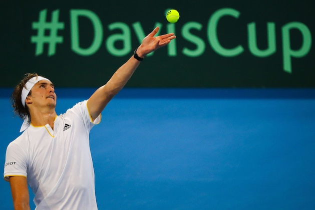 Alexander Zverev of Germany serves against Alex De Minaur of Australia during their men's singles tennis match in the Davis Cup World Group tie at the Pat Rafter Arena in Brisbane on February 2, 2018. / AFP PHOTO / Patrick HAMILTON / IMAGE RESTRICTED TO EDITORIAL USE - STRICTLY NO COMMERCIAL USE        (Photo credit should read PATRICK HAMILTON/AFP/Getty Images)