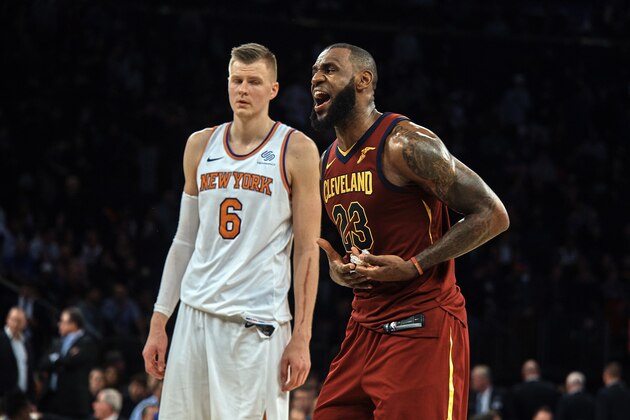 Cleveland Cavaliers' LeBron James, right, reacts next to New York Knicks' Kristaps Porzingis, left, during the second half of a NBA basketball game at Madison Square Garden in New York, Monday, Nov. 13, 2017. (AP Photo/Andres Kudacki)