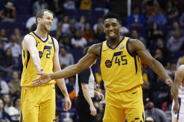 Utah Jazz forward Joe Ingles (2) and guard Donovan Mitchell (45) celebrate a score against the Phoenix Suns during the second half of an NBA basketball game Friday, Feb. 2, 2018, in Phoenix. The Jazz defeated the Suns 129-97. (AP Photo/Ross D. Franklin)