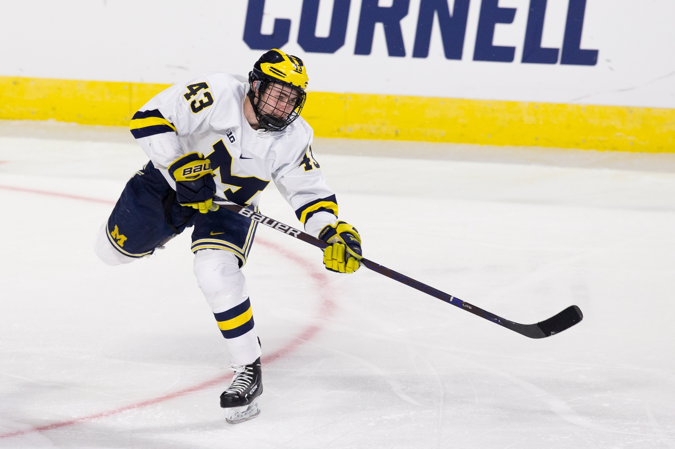 WORCESTER, MA - MARCH 25: Quinn Hughes #43 of the Michigan Wolverines skates the puck against the Boston University Terriers during the NCAA Division I Men's Ice Hockey Northeast Regional Championship Final at the DCU Center on March 25, 2018 in Worcester, Massachusetts. The Wolverines won 6-3 and advanced to the Frozen Four in Minnesota. (Photo by Richard T Gagnon/Getty Images) *** Local Caption *** Quinn Hughes