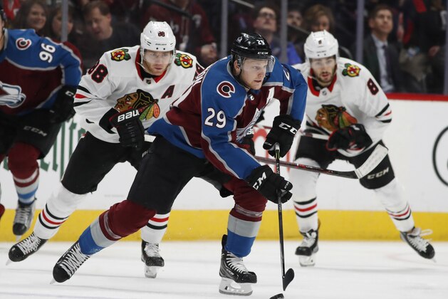 Colorado Avalanche center Nathan MacKinnon (29) and Chicago Blackhawks right wing Patrick Kane (88) in the first period of an NHL hockey game Friday, March 30, 2018, in Denver. (AP Photo/David Zalubowski) Colorado Avalanche center Nathan MacKinnon (29) and Chicago Blackhawks right wing Patrick Kane (88) in the first period of an NHL hockey game Friday, March 30, 2018, in Denver. (AP Photo/David Zalubowski)