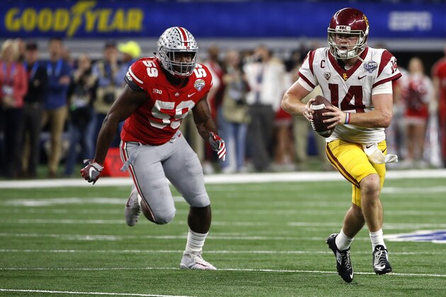 ARLINGTON, TX - DECEMBER 29: Sam Darnold #14 of the USC Trojans runs from Tyquan Lewis #59 of the Ohio State Buckeyes in the second half of the 82nd Goodyear Cotton Bowl Classic between USC and Ohio State at AT&T Stadium on December 29, 2017 in Arlington, Texas. Ohio State won 24-7. (Photo by Ron Jenkins/Getty Images) ARLINGTON, TX - DECEMBER 29: Sam Darnold #14 of the USC Trojans runs from Tyquan Lewis #59 of the Ohio State Buckeyes in the second half of the 82nd Goodyear Cotton Bowl Classic between USC and Ohio State at AT&T Stadium on December 29, 2017 in Arlington, Texas. Ohio State won 24-7. (Photo by Ron Jenkins/Getty Images)