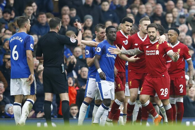 LIVERPOOL, ENGLAND - APRIL 07:  Phil Jagielka of Everton and Danny Ings of Liverpool clash during the Premier League match between Everton and Liverpool at Goodison Park on April 7, 2018 in Liverpool, England.  (Photo by Julian Finney/Getty Images)