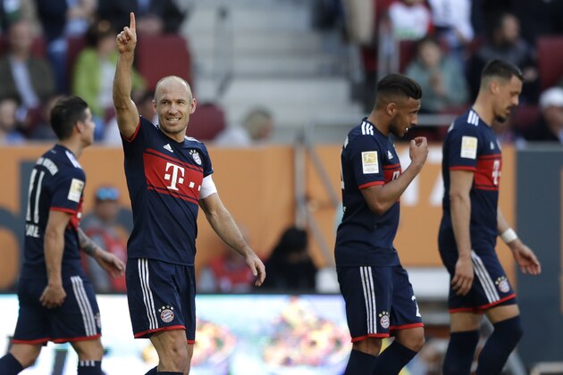 Bayern's Arjen Robben celebrates after scoring his side's third goal during the German Bundesliga soccer match between FC Augsburg and FC Bayern Munich in Augsburg, Germany, Saturday, April 7, 2018. (AP Photo/Matthias Schrader)