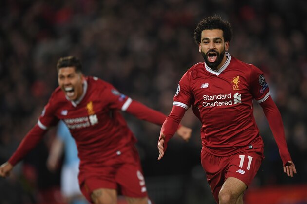 LIVERPOOL, ENGLAND - APRIL 04:  Mohamed Salah of Liverpool celebrates after scoring his sides first goal during the UEFA Champions League Quarter Final Leg One match between Liverpool and Manchester City at Anfield on April 4, 2018 in Liverpool, England.  (Photo by Shaun Botterill/Getty Images)