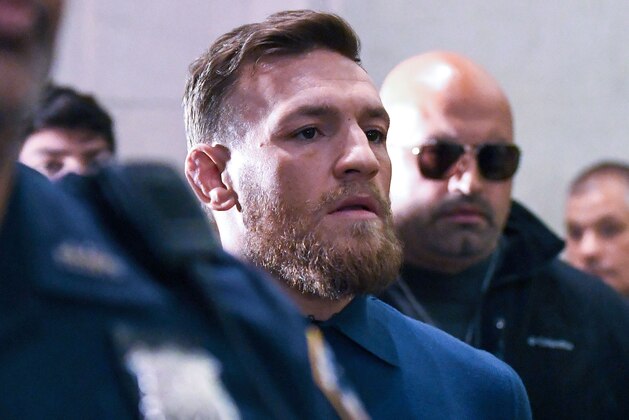 Irish Mixed Martial Arts fighter Conor McGregor leaves the Kings County (Brooklyn) Criminal Court on April 6, 2018 in New York.
Irish Mixed Martial Arts fighter Conor McGregor was charged with assault and criminal mischief by New York police on April 6, 2018 and was due to appear in court. The 29-year-old superstar reportedly surrendered at a Brooklyn police station late Thursday after allegedly attacking a shuttle bus loaded with fellow mixed martial arts fighters attending a New York media event at the Barclays Center stadium.Video footage showed McGregor hurling a dolly through a side window of the bus as it moved slowly in a parking lot at the stadium in Brooklyn.
 / AFP PHOTO / ANGELA WEISS        (Photo credit should read ANGELA WEISS/AFP/Getty Images)