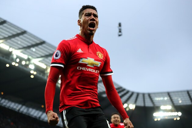 MANCHESTER, ENGLAND - APRIL 07:  Chris Smalling of Manchester United celebrates scoring a goal to make the score 2-3 during the Premier League match between Manchester City and Manchester United at Etihad Stadium on April 7, 2018 in Manchester, England. (Photo by Matthew Ashton - AMA/Getty Images)