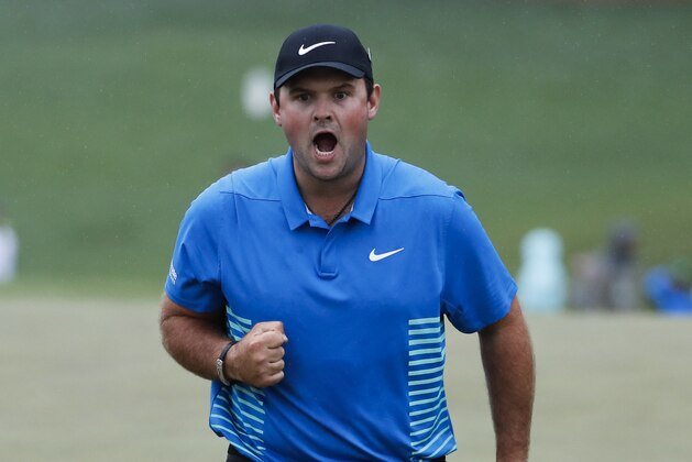Patrick Reed reacts after making a birdie putt on the ninth hole during the third round at the Masters golf tournament Saturday, April 7, 2018, in Augusta, Ga. (AP Photo/David Goldman)