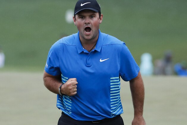 Patrick Reed reacts after making a birdie putt on the ninth hole during the third round at the Masters golf tournament Saturday, April 7, 2018, in Augusta, Ga. (AP Photo/David Goldman)
