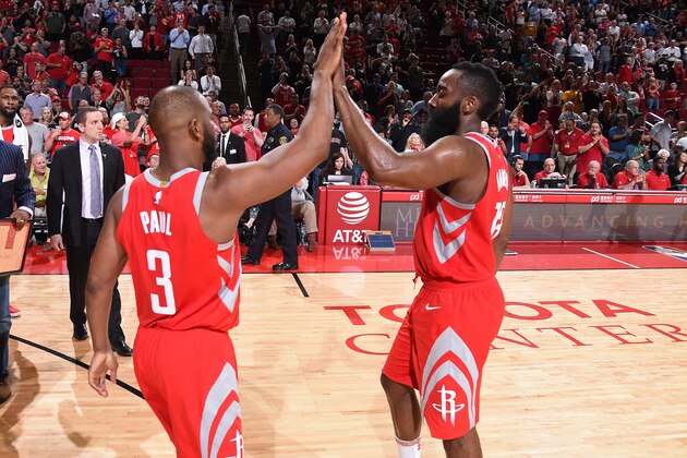 HOUSTON, TX - APRIL 5: Chris Paul #3 of the Houston Rockets and James Harden #13 of the Houston Rockets high-five during the game against the Portland Trailblazers  on April 5, 2018 at the Toyota Center in Houston, Texas. NOTE TO USER: User expressly acknowledges and agrees that, by downloading and or using this photograph, User is consenting to the terms and conditions of the Getty Images License Agreement. Mandatory Copyright Notice: Copyright 2018 NBAE (Photo by Bill Baptist/NBAE via Getty Images)