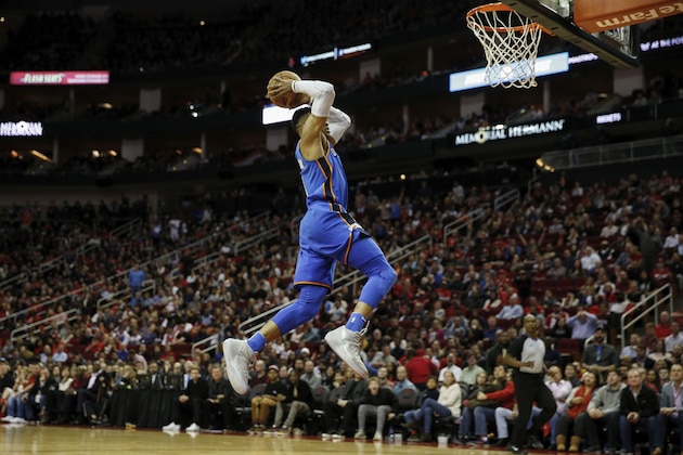 HOUSTON, TX - APRIL 07:  Russell Westbrook #0 of the Oklahoma City Thunder dunks the ball in the second half against the Houston Rockets at Toyota Center on April 7, 2018 in Houston, Texas.  NOTE TO USER: User expressly acknowledges and agrees that, by downloading and or using this Photograph, user is consenting to the terms and conditions of the Getty Images License Agreement.  (Photo by Tim Warner/Getty Images)