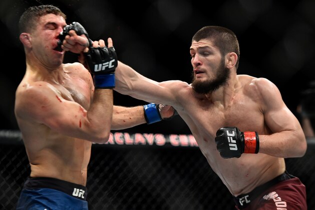 BROOKLYN, NEW YORK - APRIL 07:  (R-L) Khabib Nurmagomedov of Russia punches Al Iaquinta in their lightweight title bout during the UFC 223 event inside Barclays Center on April 7, 2018 in Brooklyn, New York. (Photo by Brandon Magnus/Zuffa LLC/Zuffa LLC via Getty Images)