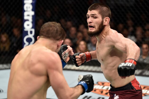 BROOKLYN, NEW YORK - APRIL 07:  (R-L) Khabib Nurmagomedov of Russia punches Al Iaquinta in their lightweight title bout during the UFC 223 event inside Barclays Center on April 7, 2018 in Brooklyn, New York. (Photo by Jeff Bottari/Zuffa LLC/Zuffa LLC via Getty Images)