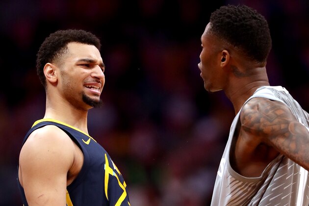 DENVER, CO - APRIL 05:  Jamal Murray #27 of the Denver Nuggets exchanges words with Jamal Crawford #11 of the Minnesota Timberwolves at the Pepsi Center on April 5, 2018 in Denver, Colorado. NOTE TO USER: User expressly acknowledges and agrees that, by downloading and or using this photograph, User is consenting to the terms and conditions of the Getty Images License Agreement.  (Photo by Matthew Stockman/Getty Images)