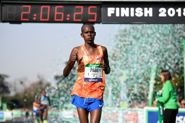 Kenya's Paul Lonyangata celebrates as he places first in the Men's Group during the 42nd edition of the Paris Marathon on April 8, 2018 in Paris.   / AFP PHOTO / Eric FEFERBERG        (Photo credit should read ERIC FEFERBERG/AFP/Getty Images)