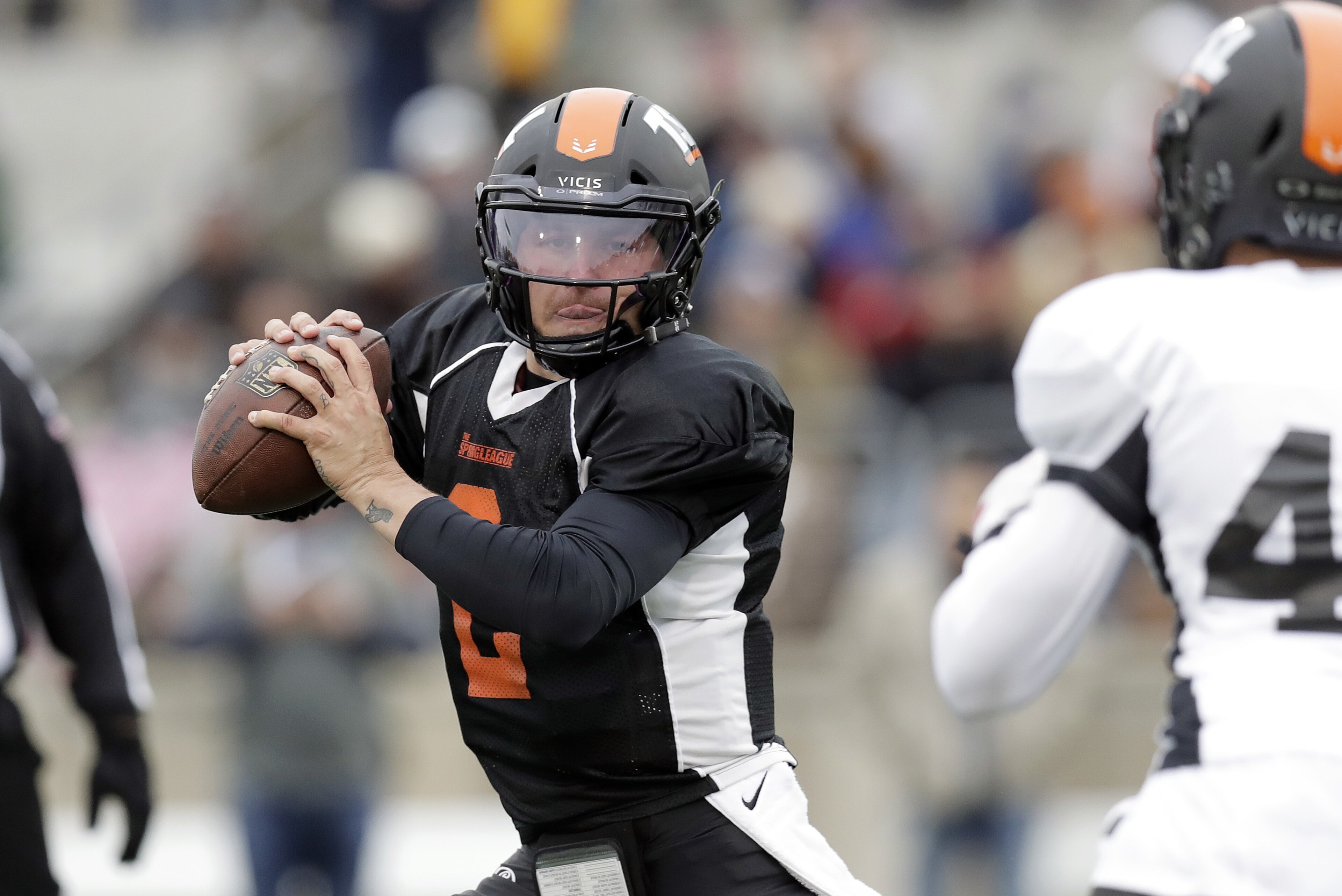 Former Heisman Trophy-winning quarterback Johnny Manziel (2) scrambles as he looks to throw during a developmental Spring League football game, Saturday, April 7, 2018, in Austin, Texas. Manziel is hoping to impress NFL scouts in his bid to return to the league. (AP Photo/Eric Gay) Former Heisman Trophy-winning quarterback Johnny Manziel (2) scrambles as he looks to throw during a developmental Spring League football game, Saturday, April 7, 2018, in Austin, Texas. Manziel is hoping to impress NFL scouts in his bid to return to the league. (AP Photo/Eric Gay)