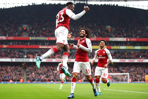 LONDON, ENGLAND - APRIL 08:  Danny Welbeck of Arsenal celebrates with team mate Mohamed Elneny and Reiss Nelson after scoring his sides second goal during the Premier League match between Arsenal and Southampton at Emirates Stadium on April 8, 2018 in London, England.  (Photo by Julian Finney/Getty Images)