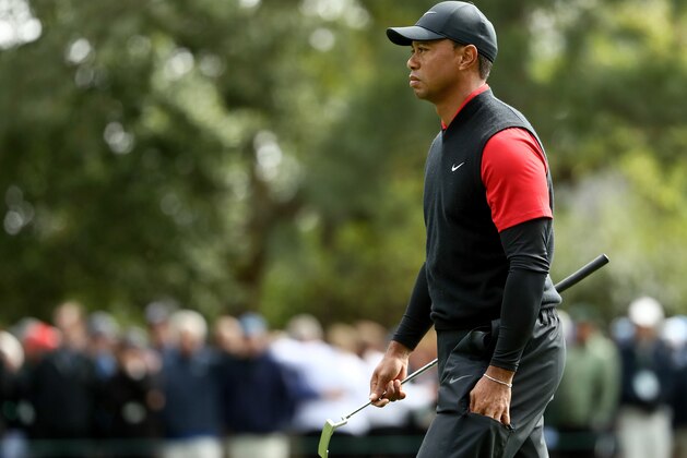 AUGUSTA, GA - APRIL 08:  Tiger Woods of the United States walks off the first green during the final round of the 2018 Masters Tournament at Augusta National Golf Club on April 8, 2018 in Augusta, Georgia.  (Photo by Jamie Squire/Getty Images)