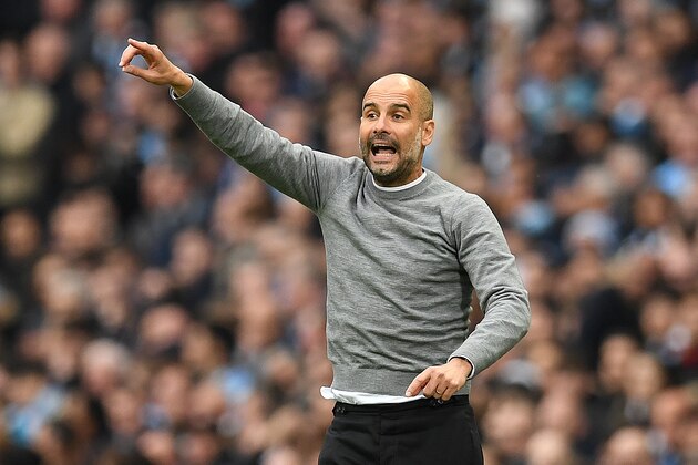Manchester City's Spanish manager Pep Guardiola shouts instructions to his players from the touchline during the English Premier League football match between Manchester City and Manchester United at the Etihad Stadium in Manchester, north west England, on April 7, 2018. / AFP PHOTO / Paul ELLIS / RESTRICTED TO EDITORIAL USE. No use with unauthorized audio, video, data, fixture lists, club/league logos or 'live' services. Online in-match use limited to 75 images, no video emulation. No use in betting, games or single club/league/player publications.  /         (Photo credit should read PAUL ELLIS/AFP/Getty Images)