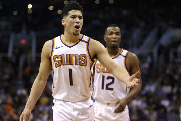 Phoenix Suns guard Devin Booker (1) in the second half during an NBA basketball game against the Cleveland Cavaliers, Tuesday, March 13, 2018, in Phoenix. The Cavaliers defeated the Suns 129-107. (AP Photo/Rick Scuteri)