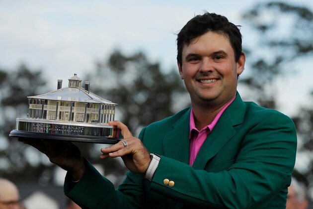 Patrick Reed holds the championship trophy after winning the Masters golf tournament Sunday, April 8, 2018, in Augusta, Ga. (AP Photo/David J. Phillip)