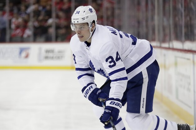 Toronto Maple Leafs center Auston Matthews skates with the puck against the New Jersey Devils during the first period of an NHL hockey game, Thursday, April 5, 2018, in Newark, N.J. (AP Photo/Julio Cortez)