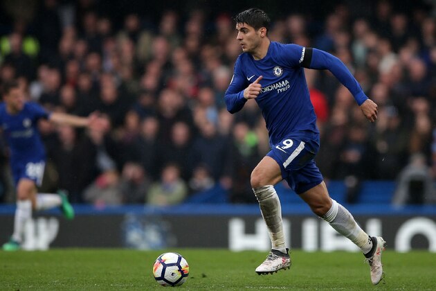 Chelsea's Spanish striker Alvaro Morata runs with the ball during the English Premier League football match between Chelsea and West Ham United at Stamford Bridge in London on April 8, 2018. / AFP PHOTO / Daniel LEAL-OLIVAS / RESTRICTED TO EDITORIAL USE. No use with unauthorized audio, video, data, fixture lists, club/league logos or 'live' services. Online in-match use limited to 75 images, no video emulation. No use in betting, games or single club/league/player publications.  /         (Photo credit should read DANIEL LEAL-OLIVAS/AFP/Getty Images)