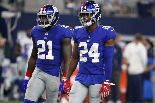 New York Giants safety Landon Collins (21) and cornerback Eli Apple (24) walk up to the line of scrimmage during an NFL football game against the Dallas Cowboys on Sunday, Sept. 10, 2017, in Arlington, Texas. (AP Photo/Michael Ainsworth)