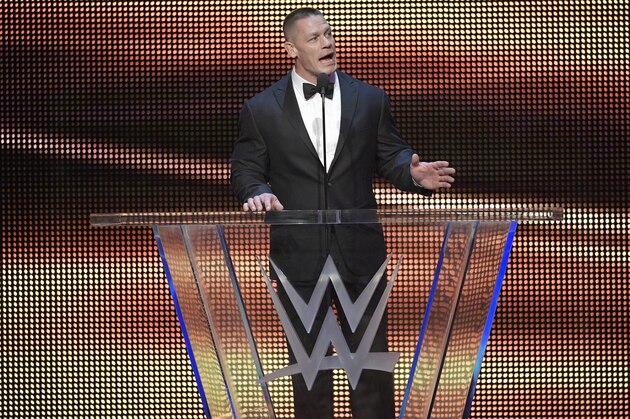 IMAGE DISTRIBUTED FOR WWE - John Cena inducts Kurt Angle into the WWE Hall of Fame as part of the WrestleMania 33 weekend during a ceremony on Friday, March 31, 2017, in Orlando, Fla. (Phelan M. Ebenhack/AP Images for WWE)