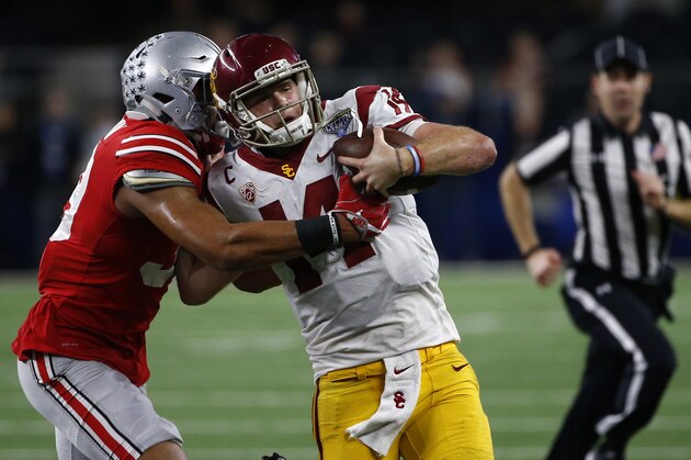 ARLINGTON, TX - DECEMBER 29: Malik Harrison #39 of the Ohio State Buckeyes runs Sam Darnold #14 of the USC Trojans out of bounds in the second half of the 82nd Goodyear Cotton Bowl Classic between USC and Ohio State at AT&T Stadium on December 29, 2017 in Arlington, Texas. Ohio State won 24-7. (Photo by Ron Jenkins/Getty Images) ARLINGTON, TX - DECEMBER 29: Malik Harrison #39 of the Ohio State Buckeyes runs Sam Darnold #14 of the USC Trojans out of bounds in the second half of the 82nd Goodyear Cotton Bowl Classic between USC and Ohio State at AT&T Stadium on December 29, 2017 in Arlington, Texas. Ohio State won 24-7. (Photo by Ron Jenkins/Getty Images)
