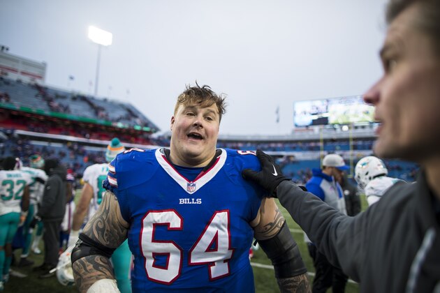 ORCHARD PARK, NY - DECEMBER 17:  Richie Incognito #64 of the Buffalo Bills speaks with members of the Miami Dolphins after the game at New Era Field on December 17, 2017 in Orchard Park, New York. Buffalo defeats Miami 24-16.  (Photo by Brett Carlsen/Getty Images)