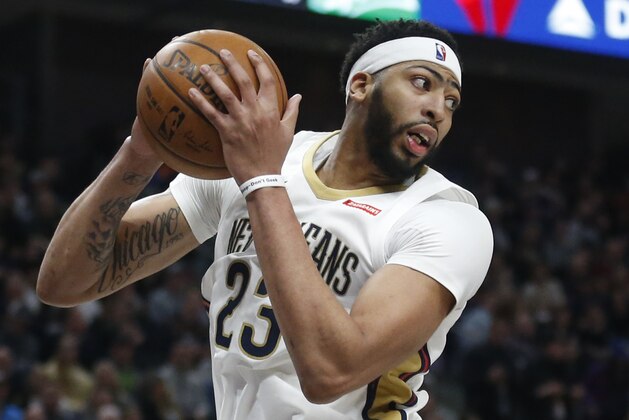 New Orleans Pelicans forward Anthony Davis (23) pulls down a rebound during the second half of the team's NBA basketball game against the Utah Jazz on Wednesday, Jan. 3, 2018, in Salt Lake City. (AP Photo/Rick Bowmer)