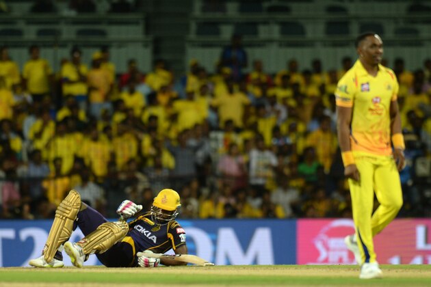 Kolkata Knight Riders cricketer Andre Russell (L) slips on the pitch during the 2018 Indian Premier League (IPL) Twenty20 cricket match between Chennai Super Kings and Kolkata Knight Riders at M.A. Chidhambaram Cricket Stadium in Chennai on April 10, 2018. / AFP PHOTO / ARUN SANKAR        (Photo credit should read ARUN SANKAR/AFP/Getty Images)