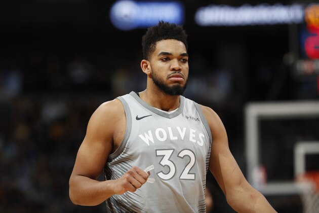 Minnesota Timberwolves center Karl-Anthony Towns (32) in the second half of an NBA basketball game Thursday, April 5, 2018, in Denver. The Nuggets won 100-96. (AP Photo/David Zalubowski)