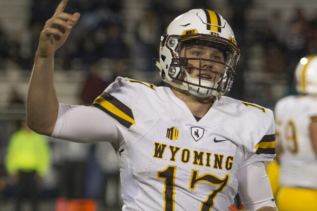 Wyoming quarterback Josh Allen reacts after scoring a touchdown in the second half of an NCAA college football game against Nevada on Saturday, Oct. 22, 2016 in Reno, Nev. (AP Photo/Tom R. Smedes)