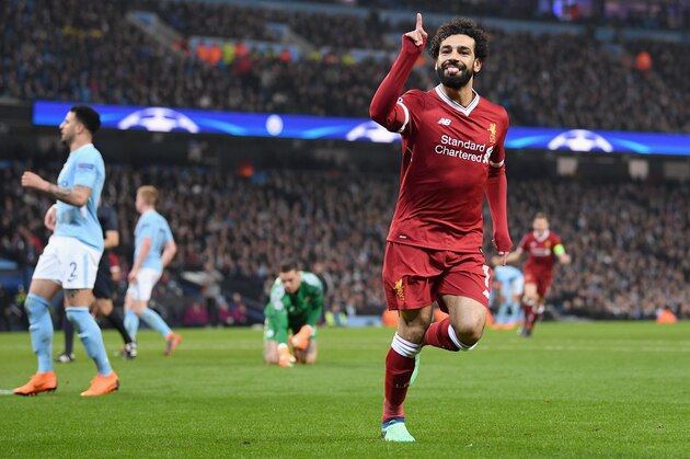 MANCHESTER, ENGLAND - APRIL 10:  Mohamed Salah of Liverpool celebrates after scoring his sides first goal during the UEFA Champions League Quarter Final Second Leg match between Manchester City and Liverpool at Etihad Stadium on April 10, 2018 in Manchester, England.  (Photo by Laurence Griffiths/Getty Images,)