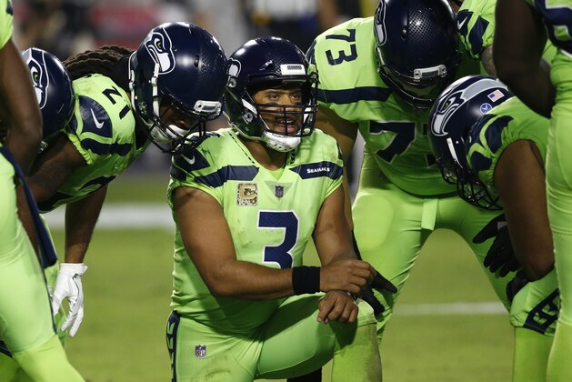 Seattle Seahawks quarterback Russell Wilson (3) huddles up his team during the second half of an NFL football game against the Arizona Cardinals, Thursday, Nov. 9, 2017, in Glendale, Ariz. (AP Photo/Ross D. Franklin)