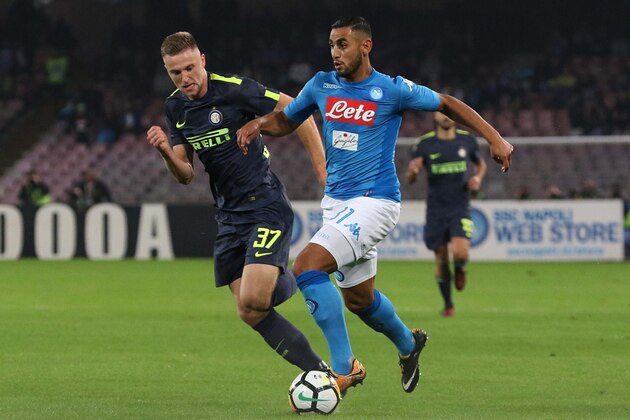 Napoli's Faouzi Ghoulam, right, and Inter's Milan Skriniar vie for the ball during the Italian Serie A soccer match between Napoli and Internazionale of Milan at the San Paolo stadium in Naples, Italy, Saturday, Oct. 21 2017. (Cesare Abbate/ANSA via AP)