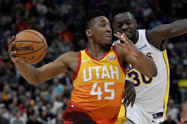 SALT LAKE CITY, UT - APRIL 03: Donovan Mitchell #45 of the Utah Jazz drives against the defense of Julius Randle #30 of the Los Angeles Lakers in the second half of a game at Vivint Smart Home Arena on April 3, 2018 in Salt Lake City, Utah. The Jazz beat the Lakers 117-110. NOTE TO USER: User expressly acknowledges and agrees that, by downloading and or using this photograph, User is consenting to the terms and conditions of the Getty Images License Agreement. (Photo by Gene Sweeney Jr./Getty Images)