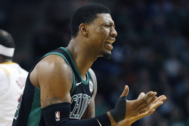 Boston Celtics' Marcus Smart protests a call during the fourth quarter of an NBA basketball game against the Indiana Pacers in Boston, Sunday, March 11, 2018. The Pacers won 99-97. (AP Photo/Michael Dwyer)