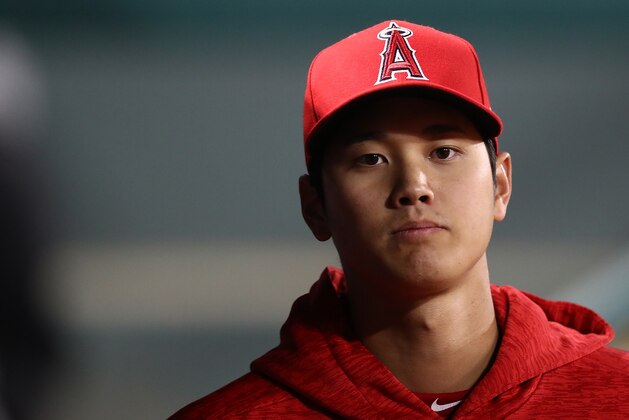 ARLINGTON, TX - APRIL 09:  Shohei Ohtani #17 of the Los Angeles Angels in the dugout during play against the Texas Rangers at Globe Life Park in Arlington on April 9, 2018 in Arlington, Texas.  (Photo by Ronald Martinez/Getty Images)