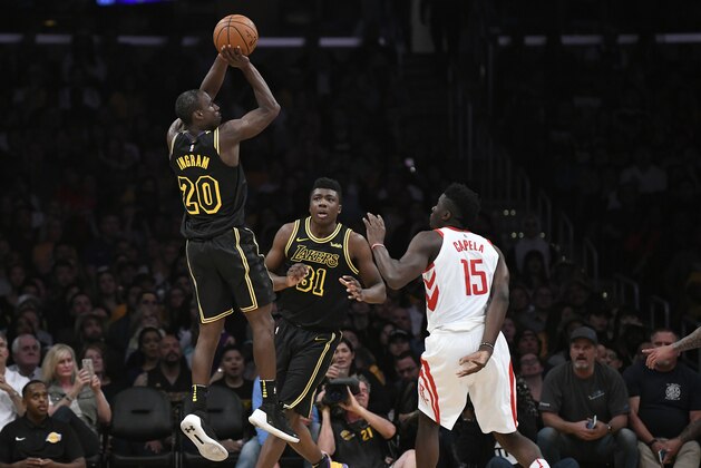 LOS ANGELES, CA - APRIL 10:  Andre Ingram #20 of the Los Angeles Lakers attempts a jumpshot against Clint Capela #15 of the Houston Rockets as Thomas Bryant #31 of the Lakers looks on on April 10, 2018 at STAPLES Center in Los Angeles, California. NOTE TO USER: User expressly acknowledges and agrees that, by downloading and or using this photograph, User is consenting to the terms and conditions of the Getty Images License Agreement.Ê (Photo by Robert Laberge/Getty Images)