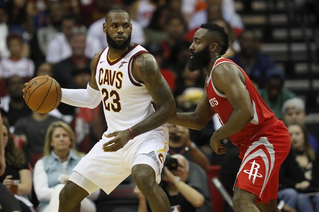 HOUSTON, TX - NOVEMBER 09:  LeBron James #23 of the Cleveland Cavaliers controls the ball against James Harden #13 of the Houston Rockets in the first half at Toyota Center on November 09, 2017 in Houston, Texas.  NOTE TO USER: User expressly acknowledges and agrees that, by downloading and or using this photograph, User is consenting to the terms and conditions of the Getty Images License Agreement.  (Photo by Tim Warner/Getty Images)