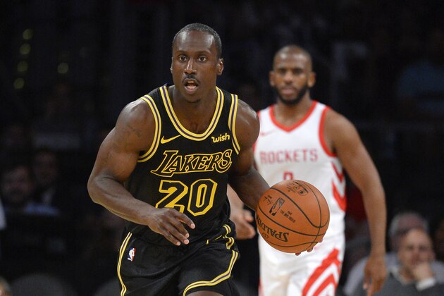 LOS ANGELES, CA - APRIL 10:  Andre Ingram #20 of the Los Angeles Lakers dribbles the ball as Chris Paul #3 of the Houston Rockets looks on, on April 10, 2018 at STAPLES Center in Los Angeles, California. NOTE TO USER: User expressly acknowledges and agrees that, by downloading and or using this photograph, User is consenting to the terms and conditions of the Getty Images License Agreement.  (Photo by Robert Laberge/Getty Images)