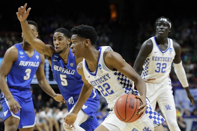 Kentucky guard Shai Gilgeous-Alexander (22) drives against Buffalo guard CJ Massinburg (5) during the first half of a second-round game in the NCAA men's college basketball tournament Saturday, March 17, 2018, in Boise, Idaho. (AP Photo/Otto Kitsinger)