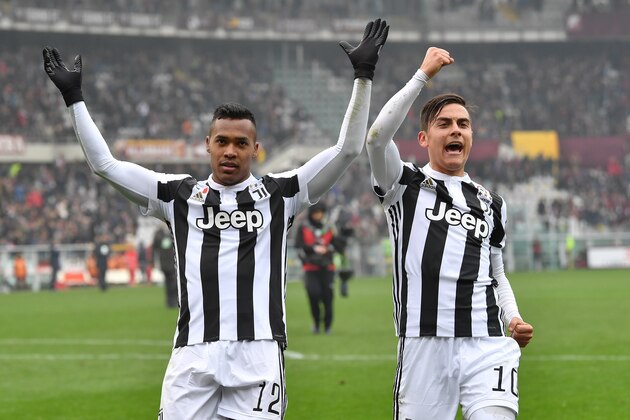 TURIN, ITALY - FEBRUARY 18: Alex Sandro (L) and Paulo Dybala of Juventus celebrate victory at the end of the Serie A match between Torino FC and Juventus at Stadio Olimpico di Torino on February 18, 2018 in Turin, Italy. (Photo by Valerio Pennicino/Getty Images) TURIN, ITALY - FEBRUARY 18: Alex Sandro (L) and Paulo Dybala of Juventus celebrate victory at the end of the Serie A match between Torino FC and Juventus at Stadio Olimpico di Torino on February 18, 2018 in Turin, Italy. (Photo by Valerio Pennicino/Getty Images)