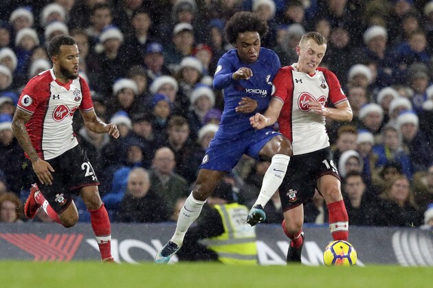 Chelsea's Willian, centre, competes for the ball with Southampton's James Ward-Prowse, right, as Southampton's Ryan Bertrand, left, chases during the English Premier League soccer match between Chelsea and Southampton at Stamford Bridge in London, Saturday Dec. 16, 2017. (AP Photo/Tim Ireland)