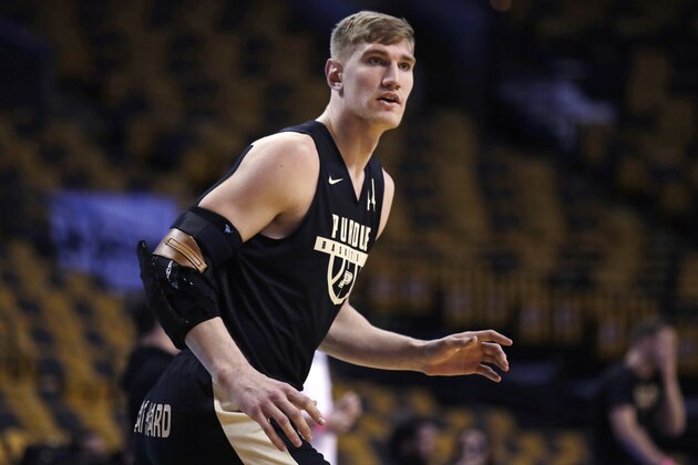 Purdue's Isaac Haas, wearing an arm brace, awaits a pass during practice at the NCAA men's college basketball tournament in Boston, Thursday, March 22, 2018. Purdue faces Texas Tech in a regional semifinal on Friday night. (AP Photo/Charles Krupa)