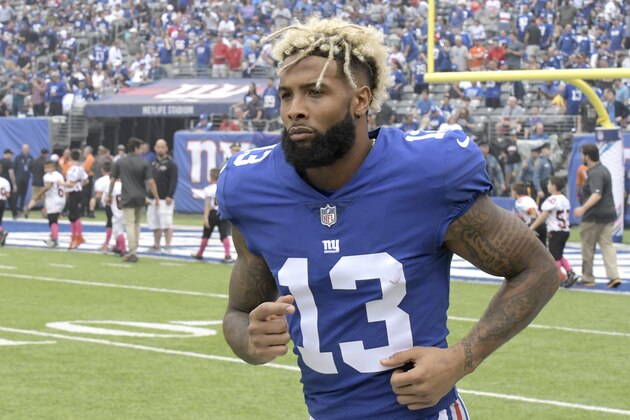 FILE - In this Oct. 8, 2017, file photo, New York Giants wide receiver Odell Beckham warms up prior to an NFL football game against the Los Angeles Chargers, in East Rutherford, N.J. Giants coach Pat Shurmur says he expects Odell Beckham Jr. to attend offseason workouts when they start in April. Trade rumors are surrounding the controversial star receiver and there has been strong speculation Beckham will hold out during training camp because he doesn't want to play the fifth and final year of his rookie deal without a new contract.
